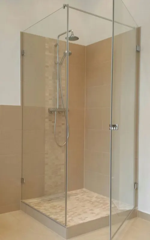 Clear-glass corner shower on a shower tray