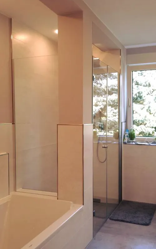 Glass shower next to the bath
